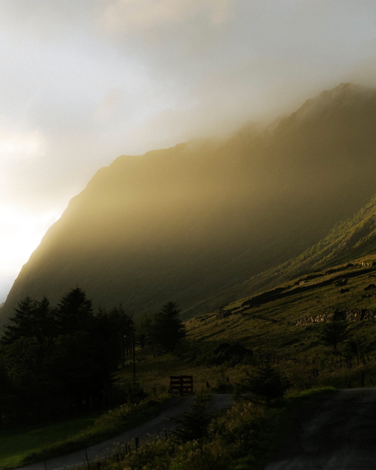 Sunlit mist over a mountainside